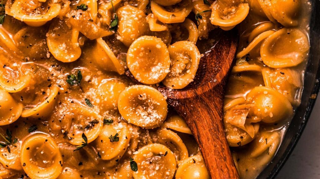 Creamy French onion pasta bubbling with melted Gruyere cheese and caramelized onions
